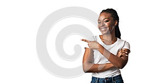 Black Woman In Braces Pointing Finger Aside, White Background, Panorama