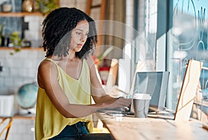 Black woman, cafe and laptop with coffee shop wifi connection while typing email or feedback. Young entrepreneur person