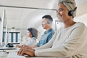 Black woman, call center consultant and contact us with CRM and happy employee at desk with keyboard and computer