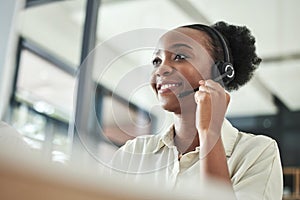 Black woman, call center and phone consultation with a smile in a office with contact us work. Telemarketing, consulting