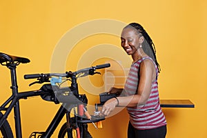 Black woman choosing bicycle tools