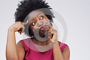 Black woman, crazy and thinking in studio for comic, comedy and silly emoji by white background. Female person, goofy