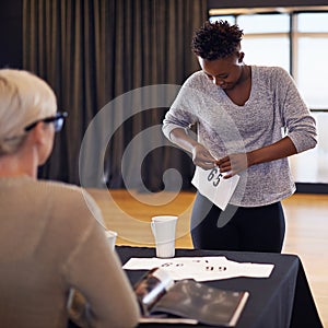 Black woman, dancer and number in audition for performance art, contemporary project or talent show. Casting, contestant photo