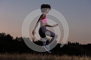 Black woman is doing stretching exercise relaxing and warm up