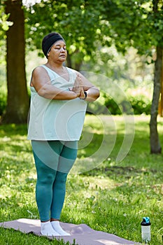 Black Woman doing Yoga in Park