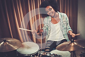 Black woman drummer in a studio