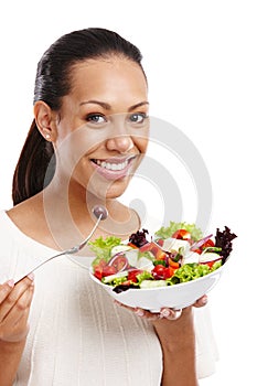 Black woman, eating vegetable salad and happy for diet nutrition, breakfast health and vegan isolated in white