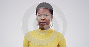 Black woman, face and blank stare standing in confidence isolated on a studio white background. Portrait of attractive