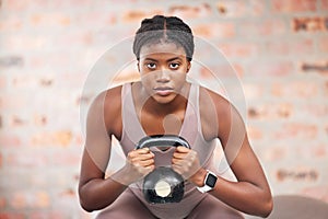 Black woman, face and kettlebell in gym workout, training or exercise for body muscle growth, cardiology wellness or