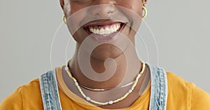 Black woman, face and teeth for dental and health in studio, happy with smile and oral hygiene on grey background. Mouth