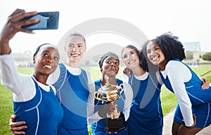 Black woman, friends and celebration in selfie, winning trophy or sports team on grass field outdoors. Happy sporty