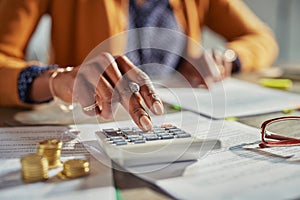 Black woman hand calculating taxes