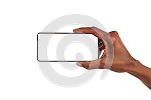 Black woman hand holds smart phone horizontally