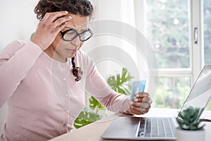 Black woman having problem with online credit card payment