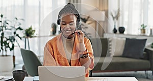 Black woman, headset in home office with laptop and phone call, remote work and crm in apartment. Virtual assistant at