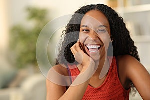 Black woman laughing at camera with white teeth