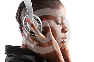 Black woman listening to music on headphones