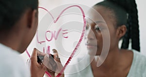 Black woman, mirror and writing heart with lipstick for love, romance or valentines day in bathroom at home. Happy