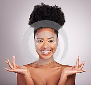 Black woman, moisturizer cream and smile for skincare beauty or cosmetics against a gray studio background. Portrait of