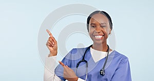 Black woman, nurse and pointing at medical information, list or announcement with smile in portrait on blue background