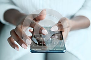 Black Woman Playing Sudoku On Phone For Brain Training