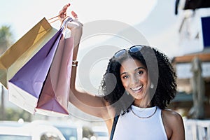 Black woman, portrait or shopping bags success in city street, road or relax urban in sales deals or commerce discount