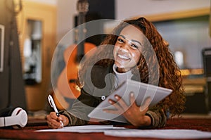 Black woman, portrait smile and tablet writing music in studio for audio track, content creation or development. Happy