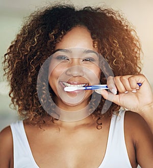 Black woman, portrait and smile with toothbrush for teeth in bathroom with dental hygiene in house. Happy, morning and
