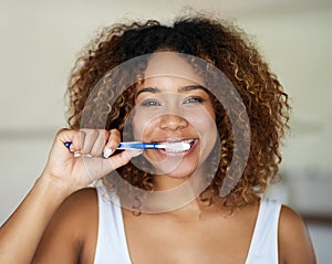 Black woman, portrait and toothbrush for smile with teeth in bathroom with dental hygiene in house. Happy, morning and