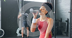 Black woman, rest and drinking water with bottle for fitness, wellness and health in gym. Young female, athlete or