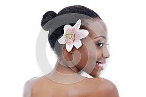 Black woman, skin and flower for natural beauty, wellness and dermatology with nature on white background. Orchid, eco