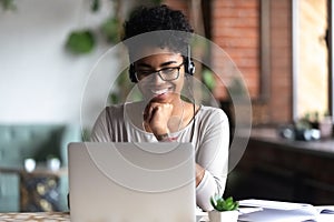 Smart student learning using internet and headphones photo