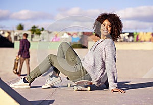 Black woman, smile and skateboard at skatepark for hobby outdoor to practice, training and relax in Atlanta. Female