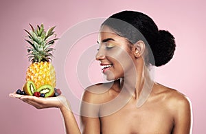Black woman, studio and beauty with fruit in hand for makeup, tropical food and clean diet with vitamin c. African model