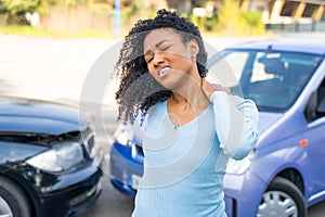 Black woman suffering neck injury after car accident