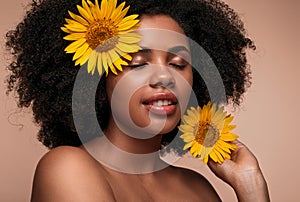 Black woman with sunflowers in hair