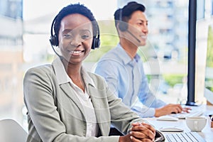 Black woman, telemarketing and smile at help desk for communication, customer support or contact in coworking call