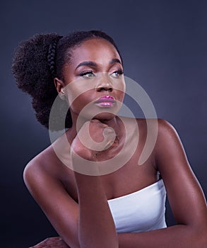 Black woman, thinking and beauty in studio with idea, inspiration or vision for inclusive cosmetics. Young thoughtful