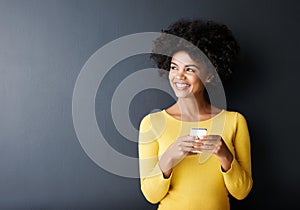 Black woman, thinking and chat on social media with phone to post, article or reading online ideas. Cellphone, app and