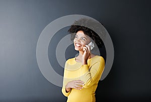 Black woman, thinking and happy phone call for planning, ideas or communication in studio background. African, face and