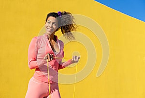 Black woman training fitness outdoors with curly hair