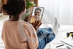 Black Woman Using Digital Tablet, Talking To Boyfriend, Rear View