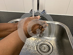 A woman washing her hands