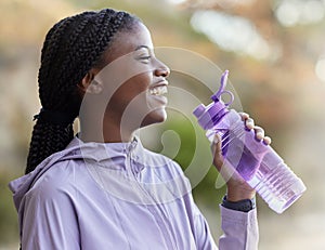 Black woman, water bottle and fitness run outdoor, relaxing and happy smile for healthy and wellness lifestyle in nature