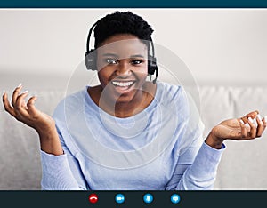 Black Woman Wearing Headset Having Video Conference photo