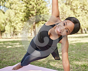 Black woman, yoga or stretching on mat in nature park for zen healthcare wellness, relax exercise or workout training