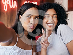 Black women, peace and sign with selfie in cafe, celebrate and party. Friends, girls and females with hand gesture