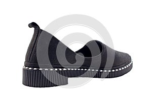 Black women`s low-heeled shoes on a white background