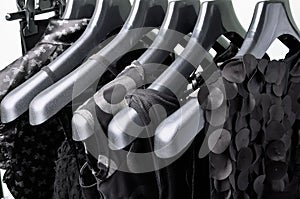 black womens clothing hanging on the black plastic hanger horizontal