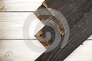 Black wood plank on white wooden texture background.